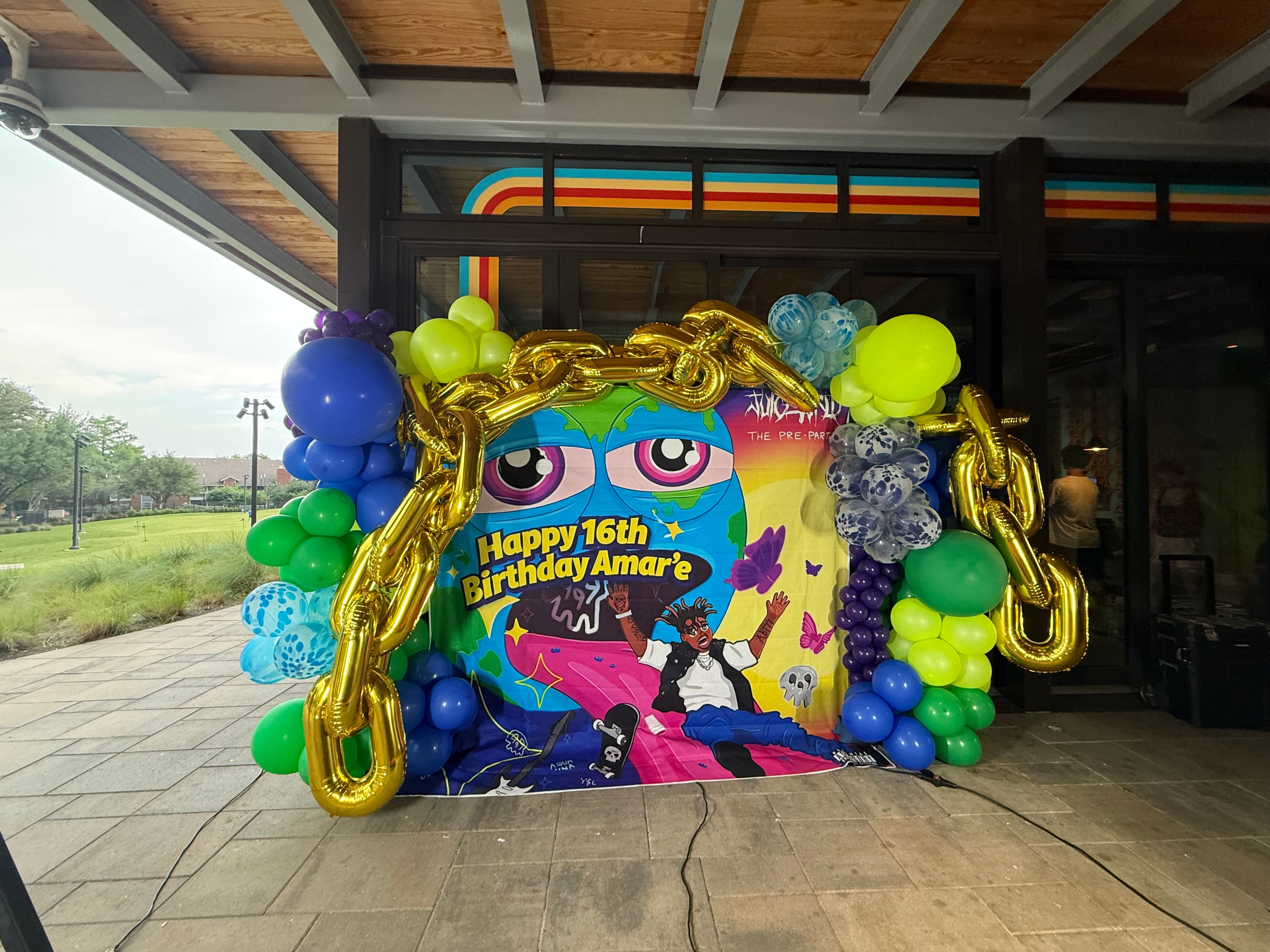 Colorful birthday party decoration with balloons and backdrop